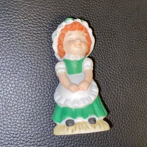 Green and White Ceramic Figurine